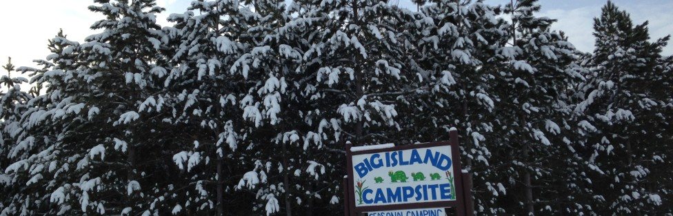 The Big Island Campsite sign under December snow